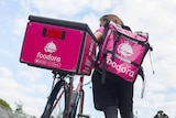 A Foodora delivery worker.