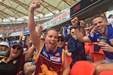 Excited Brisbane Lion's supporters cheers at AFL women's grand final