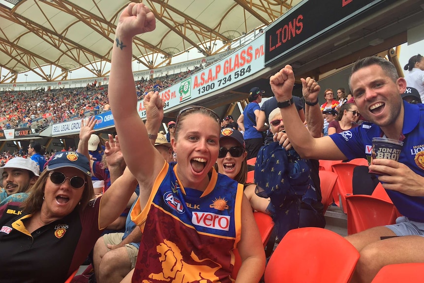 Excited Brisbane Lion's supporters cheers at AFL women's grand final