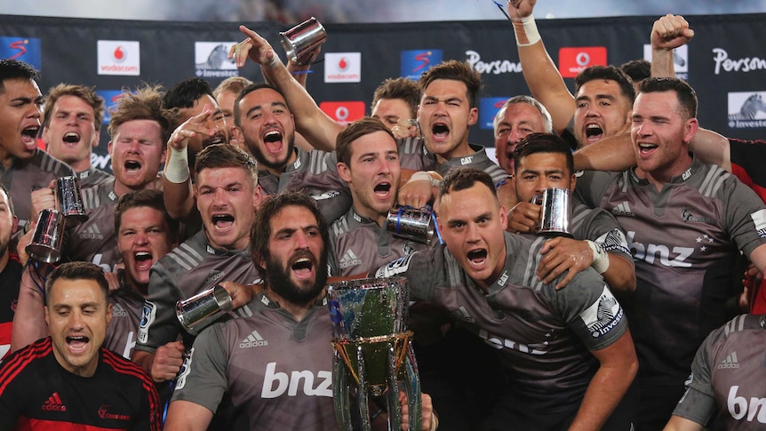 The Crusaders captain Sam Whitelock and team celebrate their Super Rugby final against South Africa's Lions.