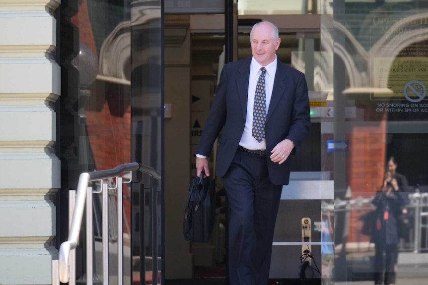 Ballistics expert, Constable Stephen Denholm walks out of Launceston Supreme Court
