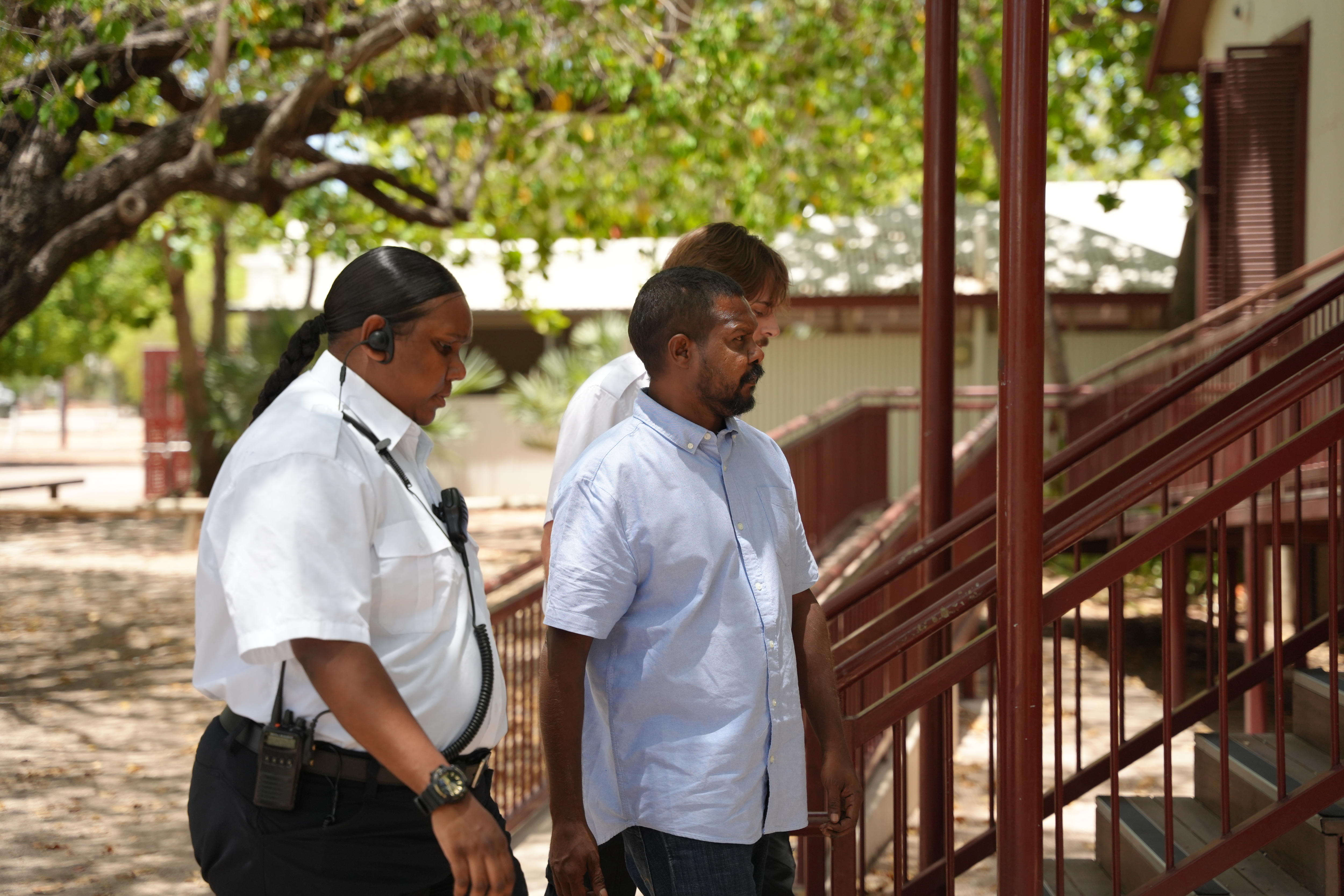 a man walking into court 