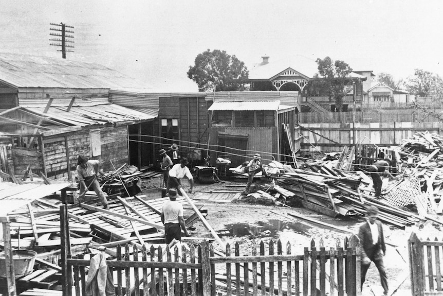A group of helpers start the recovery process after the 1918 cyclone.