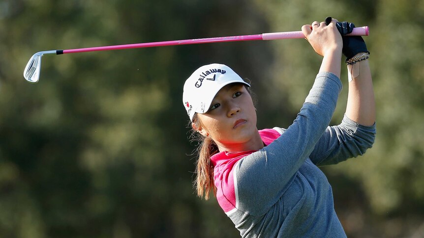 Lydia Ko of New Zealand watches her tee shot on the 15th hole