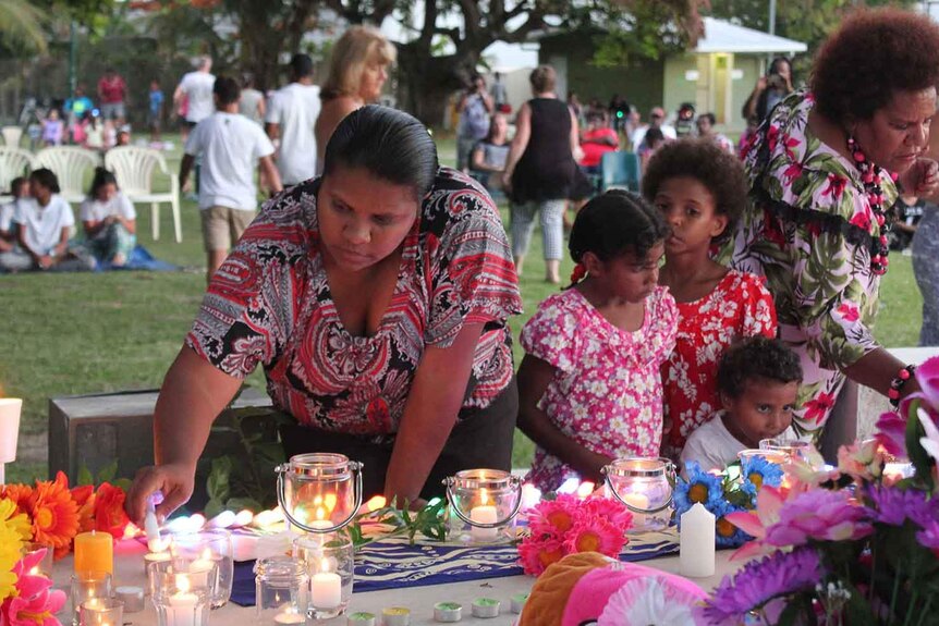 Families gather at memorial service held on December 23, 2014 at a Torres Strait Island community