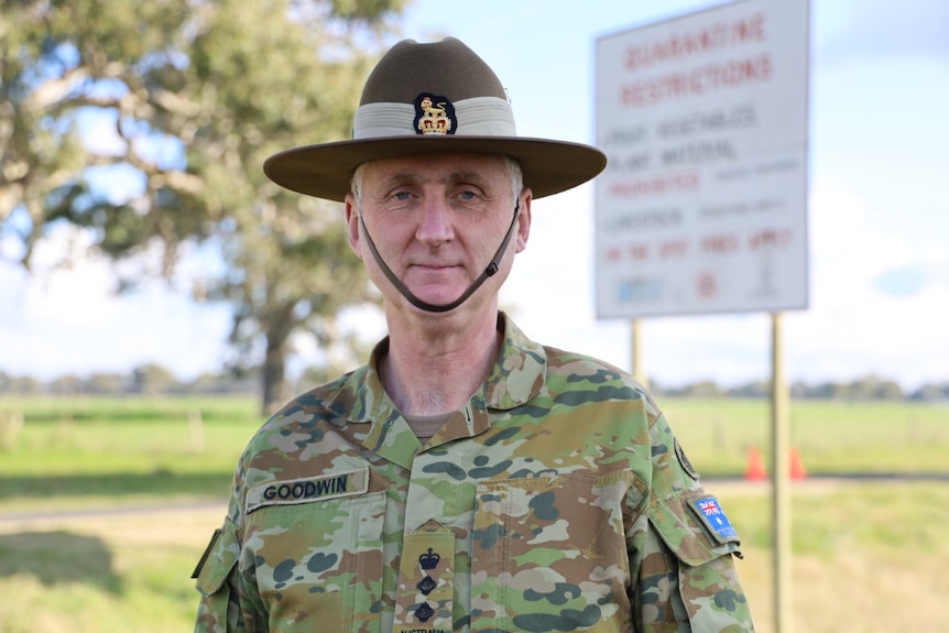 Colonel Graham Goodwin poses for a photo at one of the border checkpoints entering South Australia