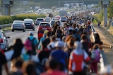 Asylum seekers march along the highway towards the border with Austria, out of Budapest, Hungary.