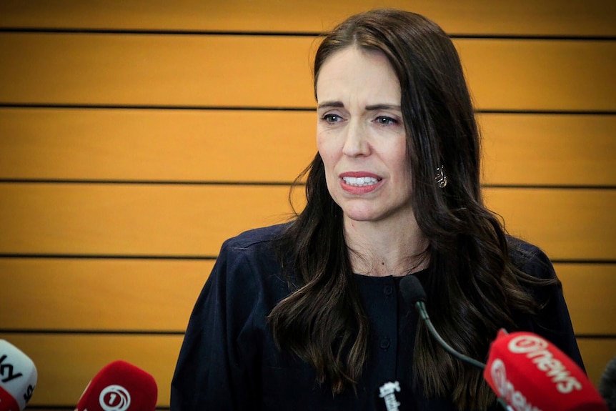 New Zealand Prime Minister Jacinda Ardern during a press conference, wearing black.