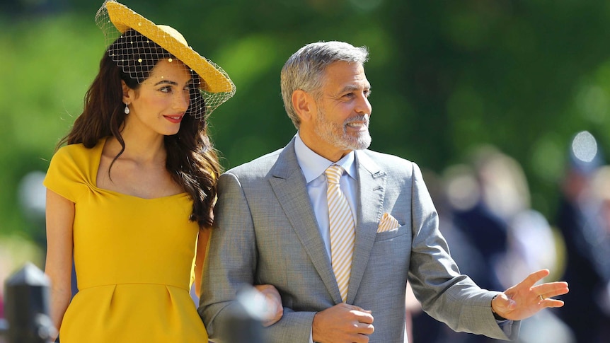 Amal Clooney and George Clooney arrive for the wedding ceremony.