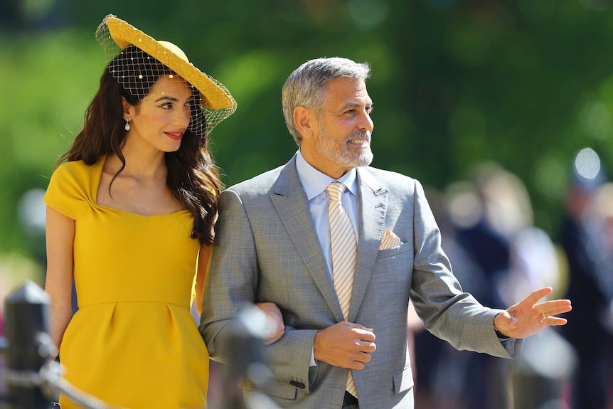 Amal Clooney and George Clooney arrive for the wedding ceremony.