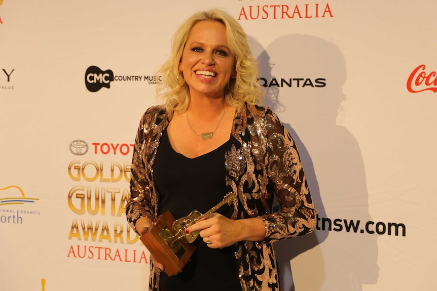 Beccy Cole with her Golden Guitar award