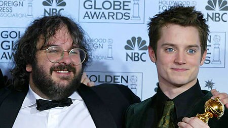 Director Peter Jackson and Elijah Wood with Golden Globe award.