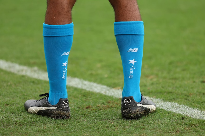 Players will wear blue socks for the 'Round to RizeUp' in their clash with Fremantle on Sunday in Carrara.
