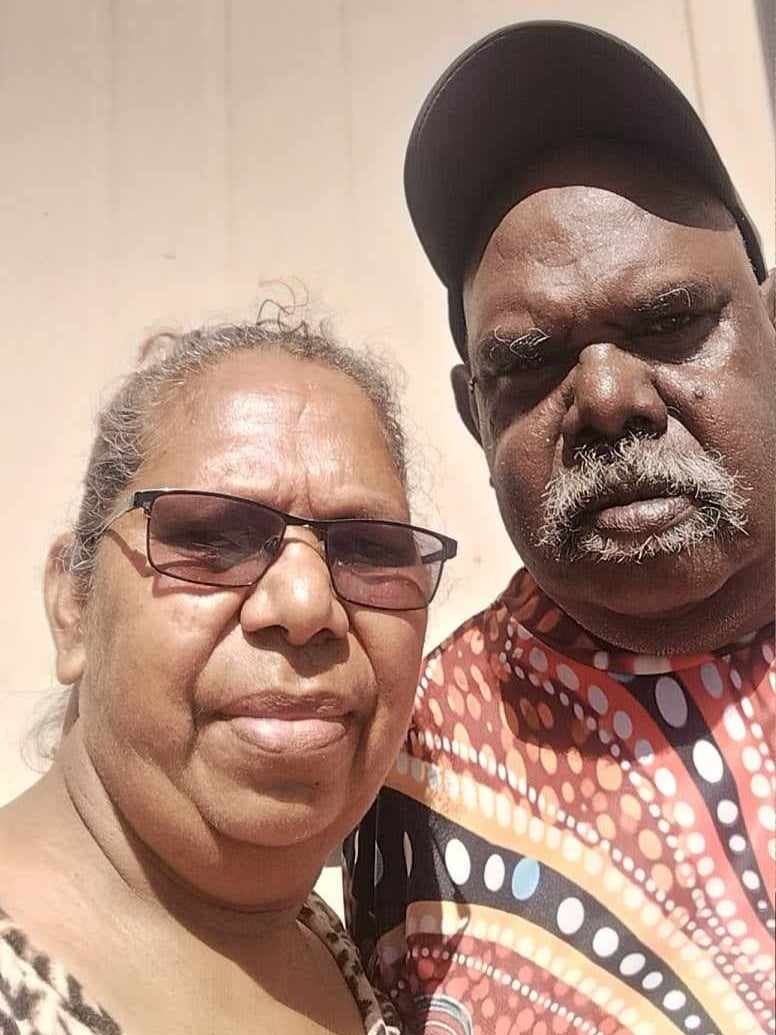 an aboriginal woman and man looking serious