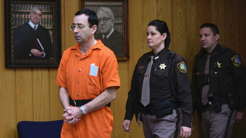 Larry Nassar enters Judge Janice Cunningham's circuit courtroom in Eaton County Circuit Court in Charlotte.