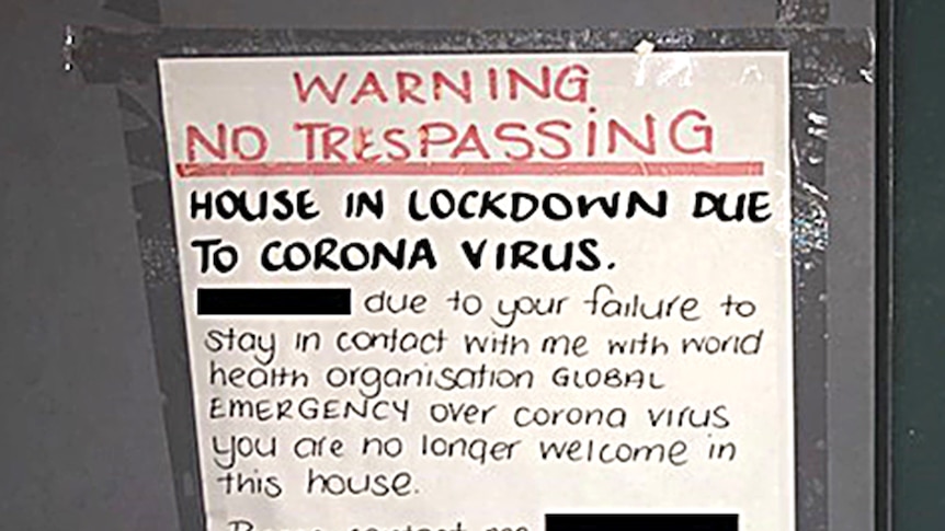 A warning sign with neat and multi-coloured writing taped to a door