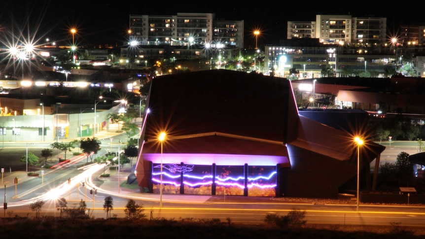 Karratha at night with the new Red Earth Arts Precinct lit up with multi-storey apartments in the background