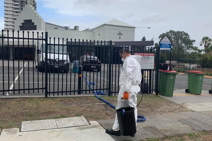 A cleaner outside the St Vincent's Catholic Church at Surfers Paradise.