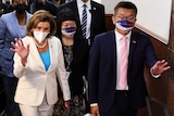 Nancy Pelosi walks next to Taiwan Legislative Yuan Vice President Tsai Chi-chang