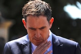 Cricket Australia CEO James Sutherland looks downwards during a media conference.