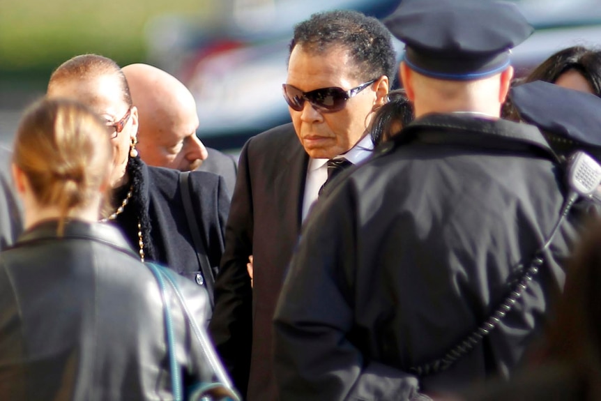 Muhammad Ali at Joe Frazier's funeral.
