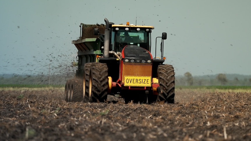 Photo of a machine spreading human waste.