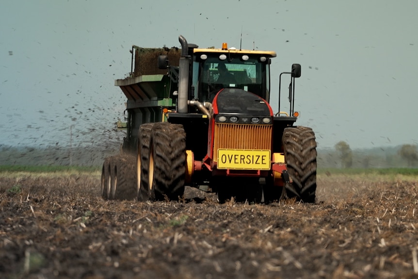 Photo of a machine spreading human waste.