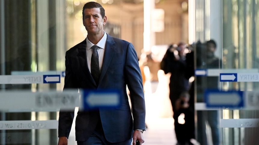 a man walking holding a briefcase