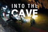 A group of rescuers travel into the cave. The words 'Into the cave' are transposed into the image.