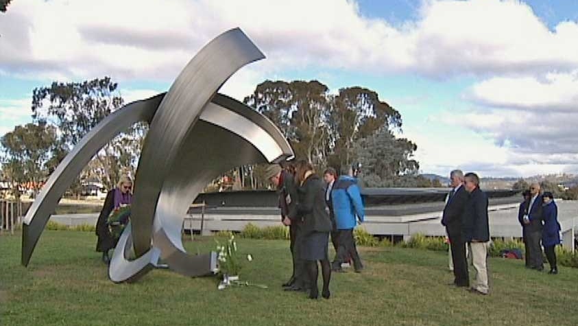 New memorial: Family and friends of those who perished on the Montevideo Maru pay their respects.