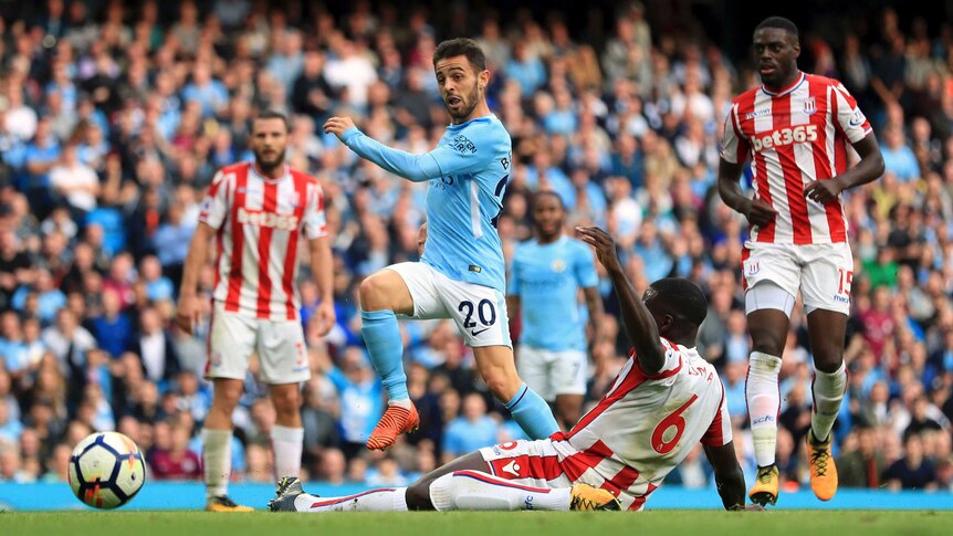 Manchester City's Bernardo Silva scores his side's seventh goal against Stoke in the Premier League.