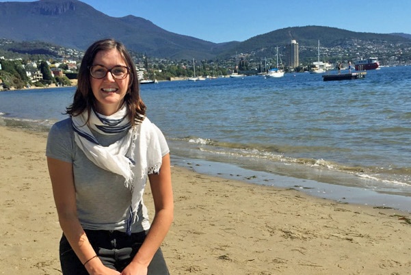 PhD candidate Kathryn Willis on a beach.