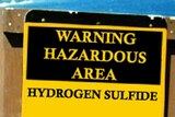 A sign warning of the dangers of hydrogen sulphide.