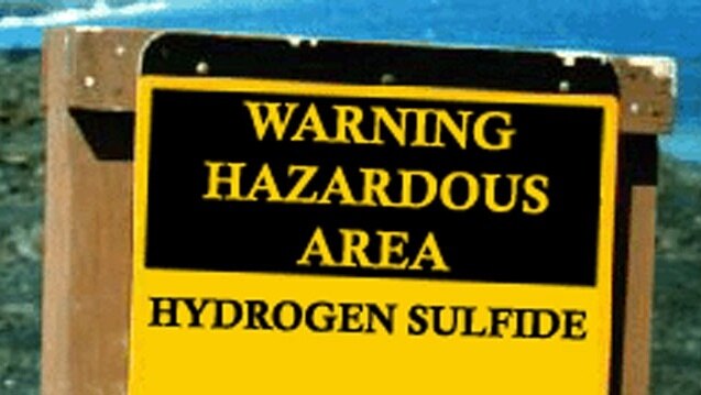 A sign warning of the dangers of hydrogen sulphide.