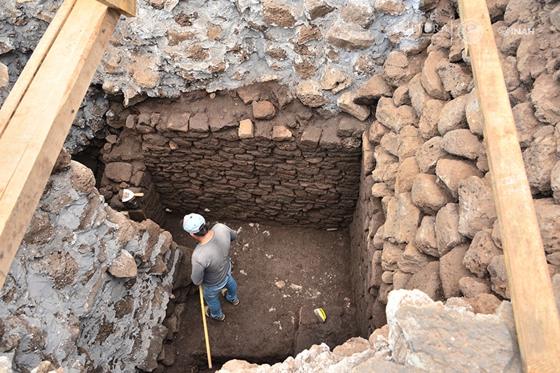 Archaeologist inspects temple site in Mexico