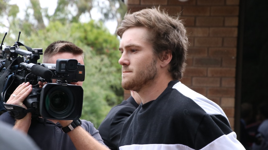 A close up of Zayvier Tamer Rose pictured next to a news camera