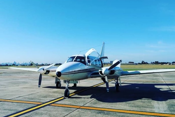 Vortex Air plane on tarmac.