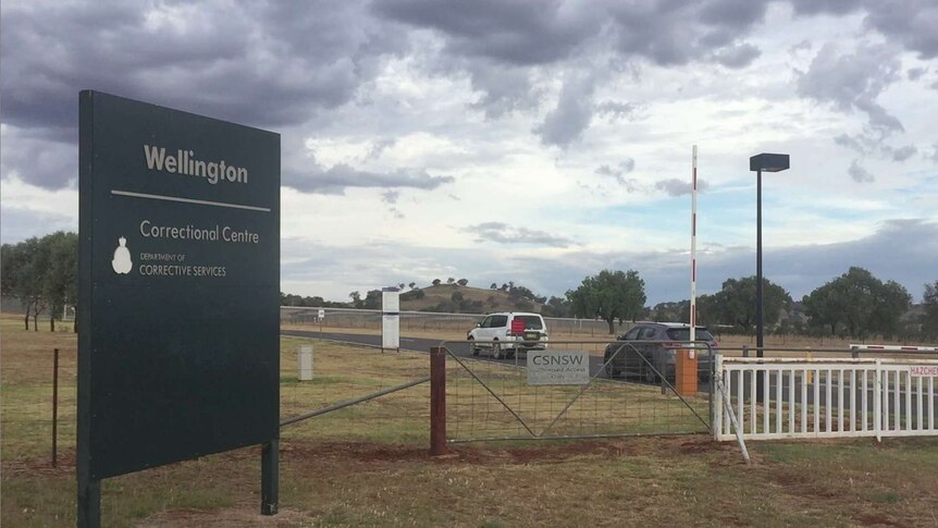 Cars enter through the front gate of Wellington Correctional Centre.