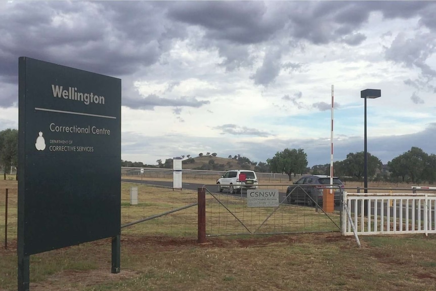 Cars enter through the front gate of Wellington Correctional Centre.