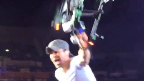Enrique Iglesias slices hand on drone during concert