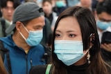 People wear masks at Hong Kong airport.