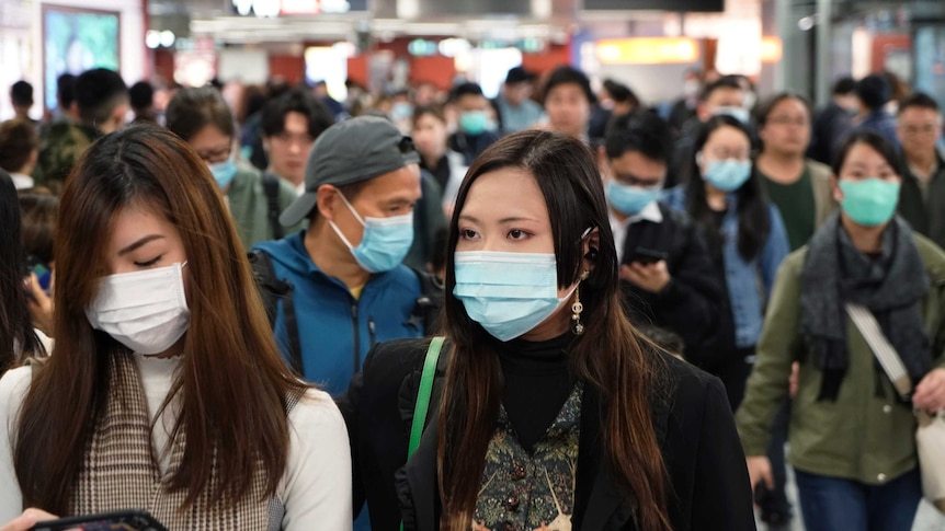 People wear masks at Hong Kong airport.