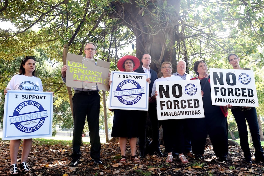 Protesters at the council amalgamation meeting