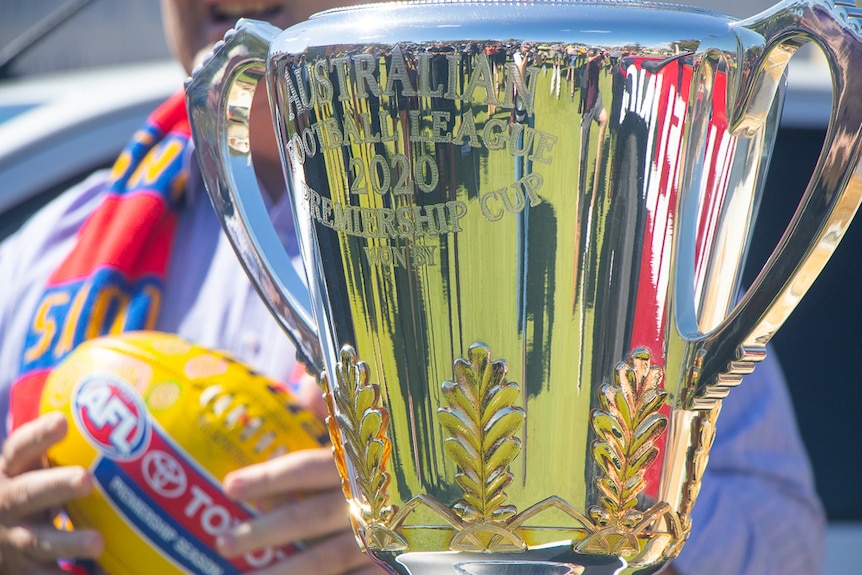 a close up of the AFL premiership cup