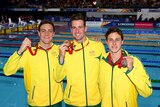 Australians James Magnussen, Cameron McEvoy (R) and Tommaso D'Orsogna (L) with their medals after the 100m freestyle in Glasgow