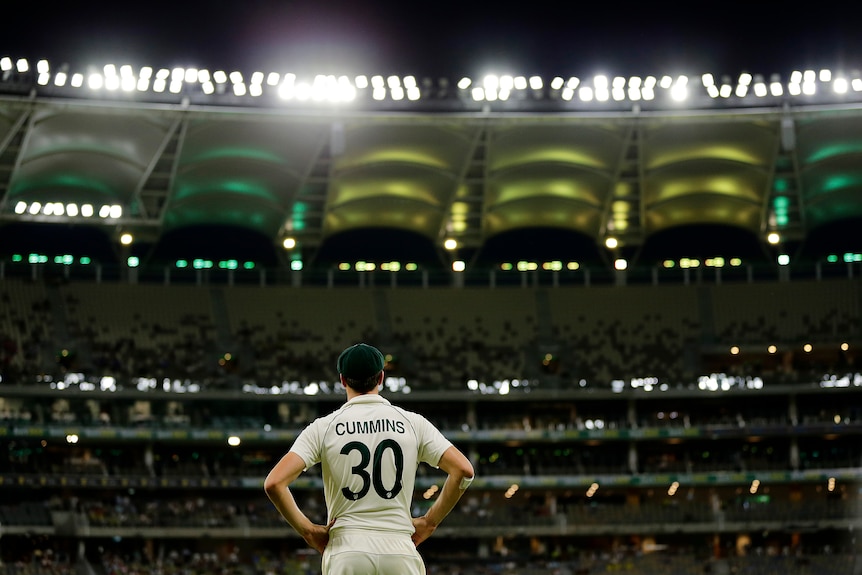 A cricketer faces the crowd during a test match