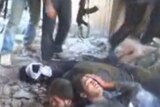 A still from footage showing Syrian government troops moments before they were killed by rebels.