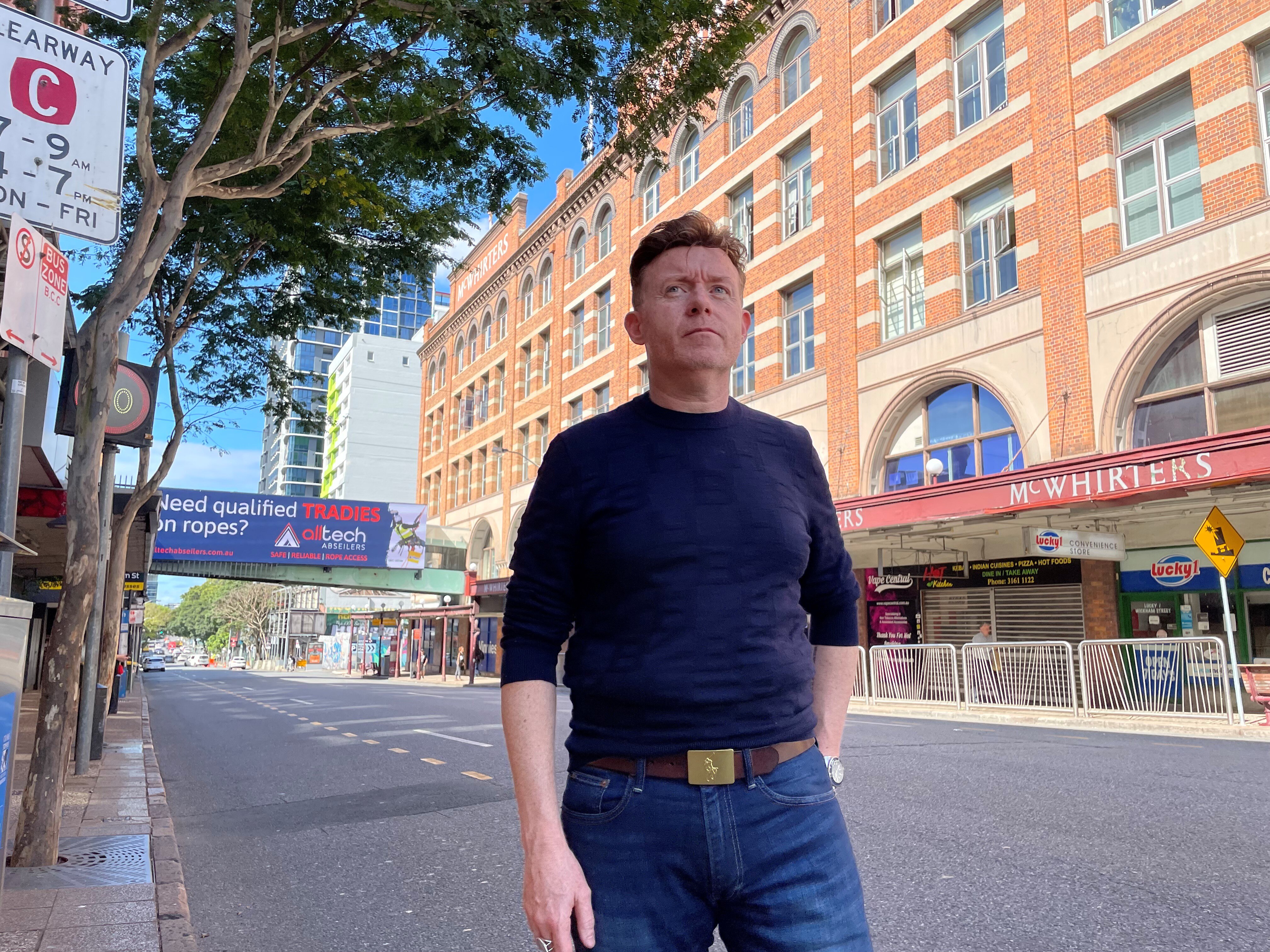 Man standing on inner city street