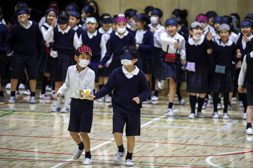 Japanese school children in face masks
