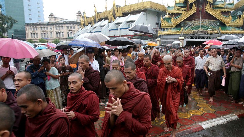 Rain has failed to deter thousands of Buddhist monks from protesting against Burma's military government.